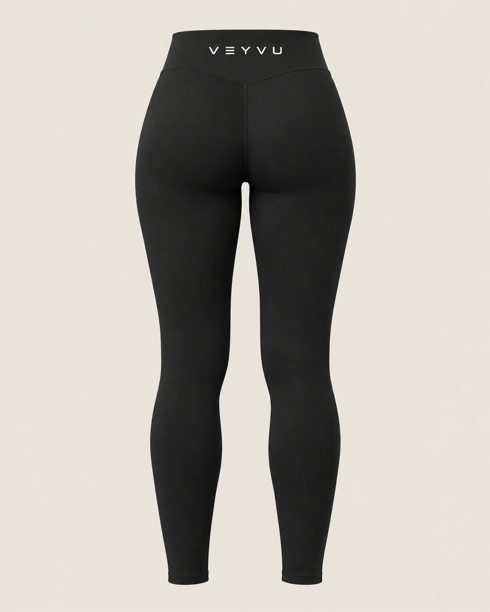 The black VEYVU high-waisted leggings, back view.